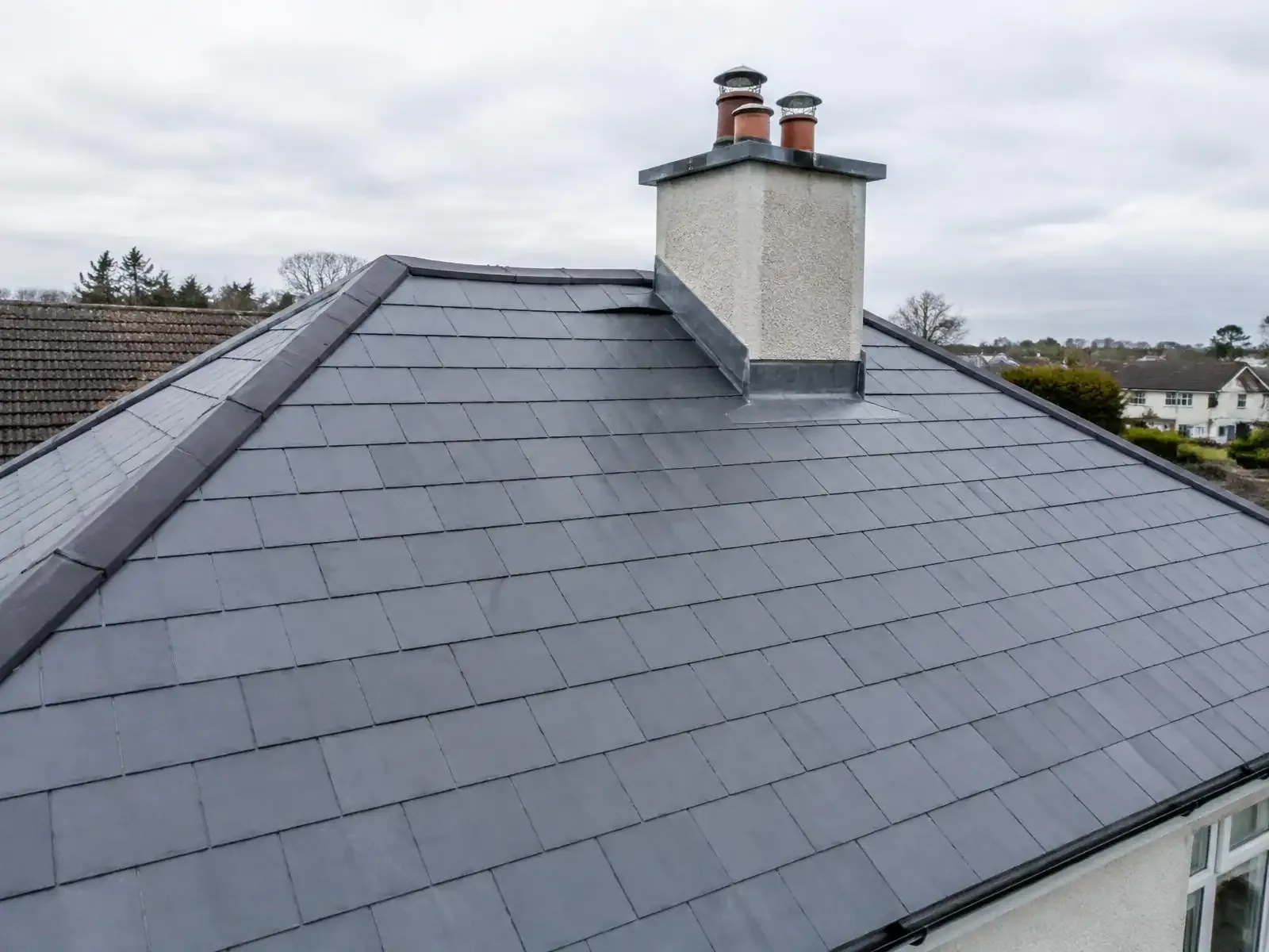 New slate roof with lead flashing